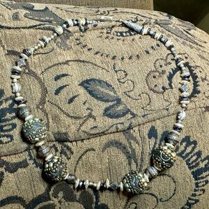 Handcrafted beaded pearl and silver necklace.